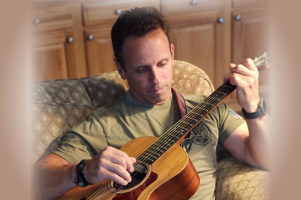 Daniel Goldstein with guitar