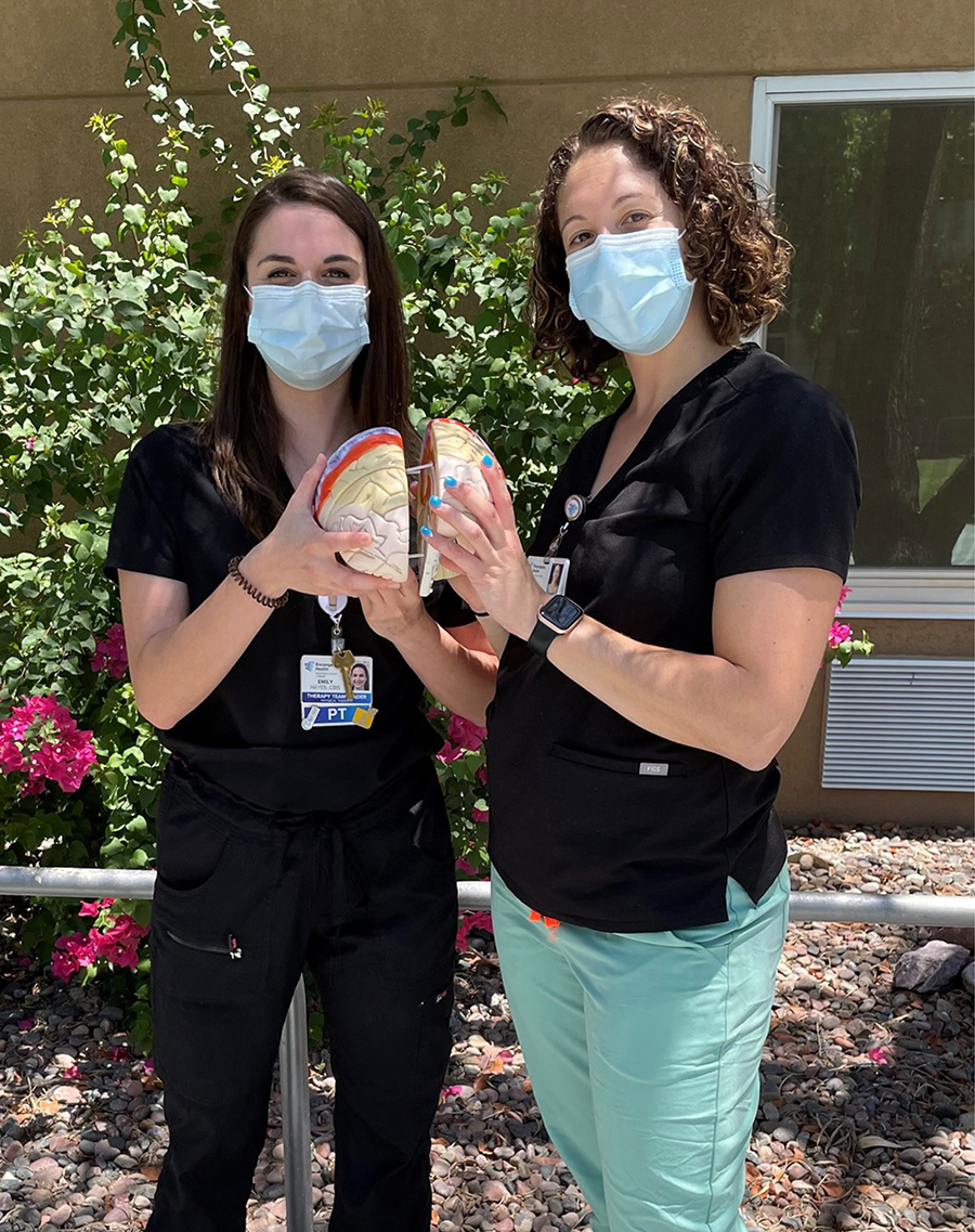 Emily Hayes, physical therapist,  joined her colleague Samantha, physical therapist, celebrating in 2021 as they become a certified neurological specialist!